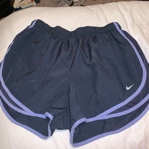 dark grey nike shorts with purple outline